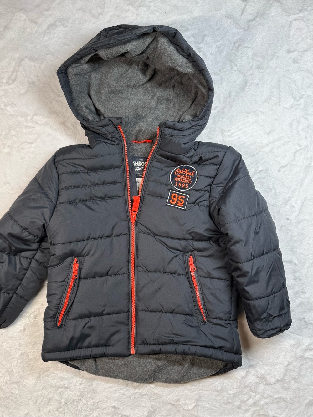 Osh Kosh B’Gosh Kids Hooded Puffer Jacket in Charcoal with Orange Accents